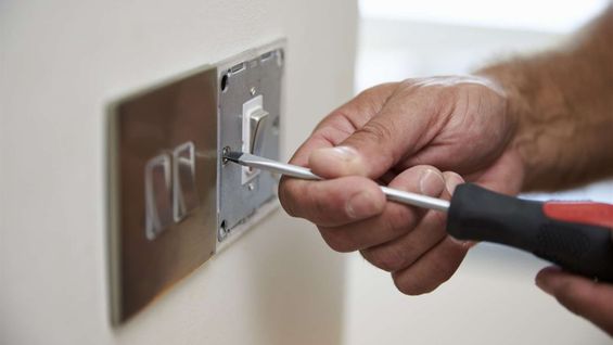 A light switch being wired up
